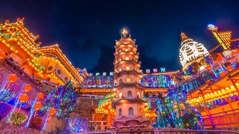 4K Time lapse of Kek Lok Si Temple view with firework and light up during sunset Stock Footage 231588239