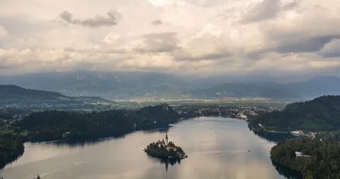 4k time lapse of lake Bled with boats driving around Stock Footage 113334345