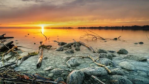 4K Time Lapse Lake Sunset Stones Clouds Slider Stock Footage 73503905