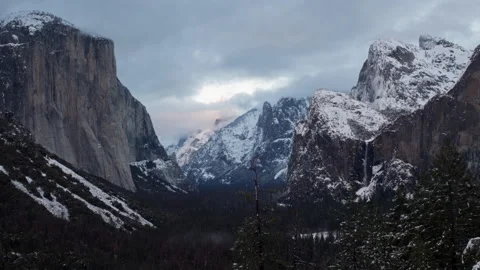 4K Time lapse long shot of clouds above Yosemite Valley partly covered with snow Stock Footage 146286390