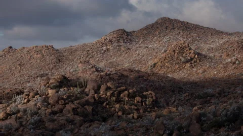 4K Time lapse of low clouds casting shadows on desert mountains in Arizona Stock Footage 147098032