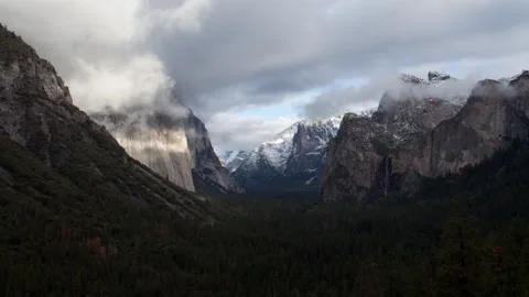4K Time lapse of low clouds and sunlight illuminating El Capitan in Yosemite Stock Footage 147108038
