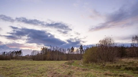 4k time-lapse of meadow under after sunset sky in autumn. Stock Footage 82244581