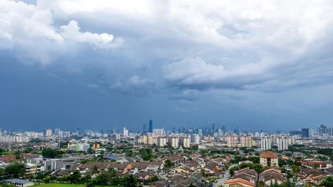 4K Time lapse of monsoon clouds over Kuala Lumpur, Malaysia. Zoom Out. Stock Footage 118786462
