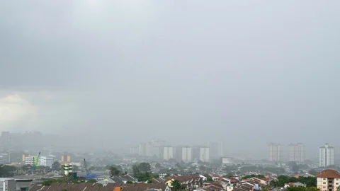 4K Time lapse of monsoon clouds over Kuala Lumpur, Malaysia. Zoom Out. Stock Footage 118791585