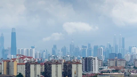 4K Time lapse of monsoon clouds over downtown Kuala Lumpur, Malaysia. Zoom In. Stock Footage 124965262