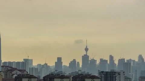 4K time lapse of monsoon clouds over down town Kuala Lumpur, Malaysia. Zoom In Stock Footage 130829710