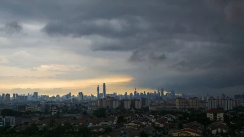 4K time lapse of monsoon rain over down town Kuala Lumpur, Malaysia. Zoom Out. Stock Footage 127692629