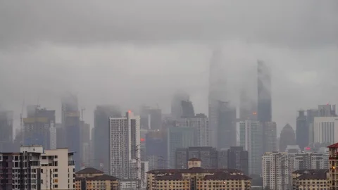 4K time lapse of monsoon rain over down town Kuala Lumpur, Malaysia Stock Footage 128998679