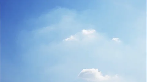 4K Time-lapse motion of puffy fluffy white clouds blue sky background. Stock Footage 121753210