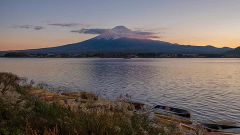 4K Time lapse of Mount Fuji with moving clouds on the peak at lake Kawaguchi Stock Footage 123377649