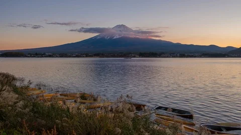4K Time lapse of Mount Fuji with moving clouds on the peak at lake Kawaguchi Stock Footage 123377747