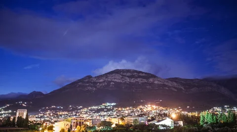 4k time lapse of a mountain town from twilight till night 24p Stock Footage 47843377