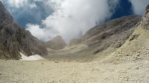 4K. Time Lapse in mountains with changeable weather: sun and deep clouds. Stock Footage 79055030