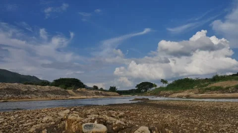 4K Time-lapse the movements of clouds,tree and river Stock Footage 68842921