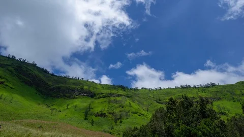 4K Time lapse of moving clouds over mountains at savanna of Bromo, East Java Stock Footage 88733474