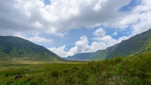 4K Time lapse of moving clouds over mountains at savanna of Bromo, East Java Stock Footage 88751859