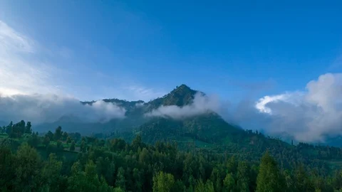 4K Time lapse of moving clouds over mountain range at Bromo Stock Footage 88761025
