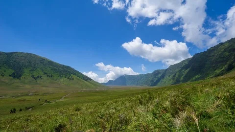 4K Time lapse of moving clouds over mountains at savanna of Bromo, East Java Stock Footage 88950465