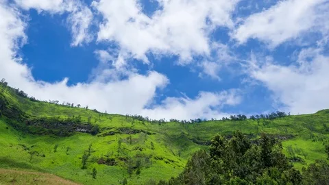 4K Time lapse of moving clouds over mountains at savanna of Bromo Stock Footage 88995339