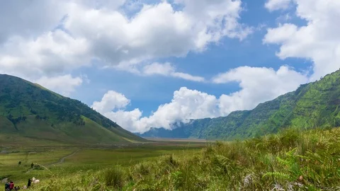 4K Time lapse of moving clouds over mountains at savanna of Bromo, East Java Stock Footage 88996738