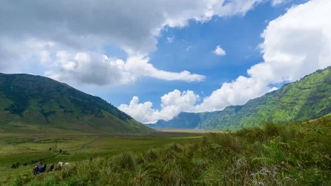4K Time lapse of moving clouds over mountains at savanna of Bromo, East Java Stock Footage 88996740