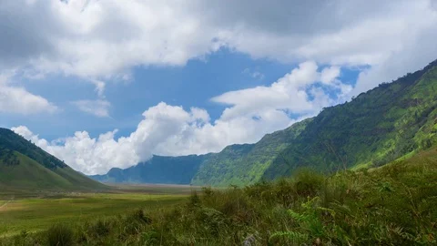 4K Time lapse of moving clouds over mountains at savanna of Bromo, East Java Stock Footage 88996742