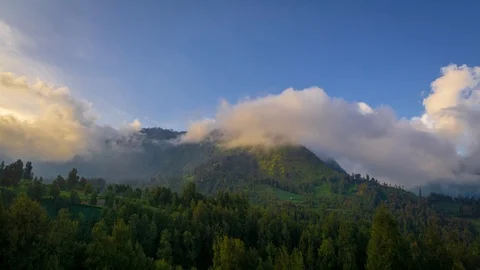 4K Time lapse of moving clouds over mountain range at Bromo Stock Footage 88999136