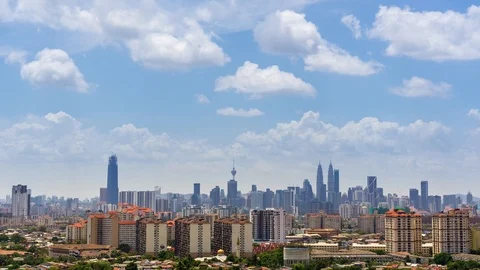 4K Time lapse of moving clouds over downtown Kuala Lumpur, Malaysia. Zoom In. Stock Footage 89955520