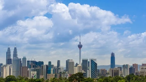 4K Time lapse of moving clouds over downtown Kuala Lumpur, Malaysia. Zoom In. Stock Footage 89968394