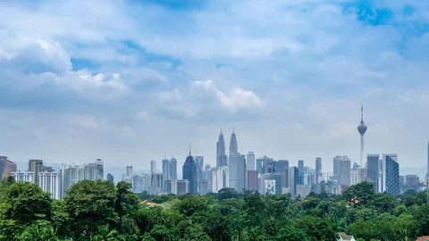 4K Time lapse of moving clouds over downtown Kuala Lumpur, Malaysia Stock Footage 95430176