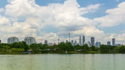 4K Time lapse of moving clouds over downtown Kuala Lumpur, Malaysia. Zoom In. Stock Footage 96950108