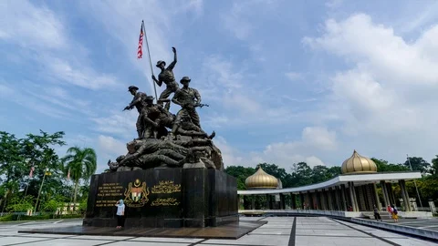4K time lapse of moving clouds over National Monument  in Kuala Lumpur. Stock Footage 97510651