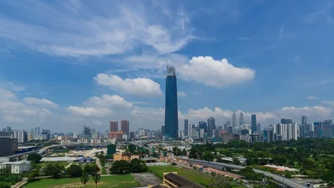 4K Time lapse of moving clouds over Exchange 106 tower. Zoom In Stock Footage 97590132