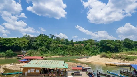 4K Time lapse of moving clouds over boat jetty on Tembeling river, Taman Negara. Stock Footage 105275885