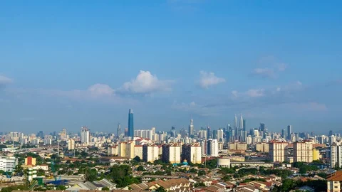 4K Time lapse of moving clouds over downtown Kuala Lumpur, Malaysia. Zoom Out Stock Footage 108635584