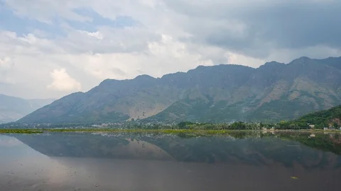 4K Time lapse of moving clouds over Dal Lake in Kashmir, India. Zoom In Stock Footage 118215099