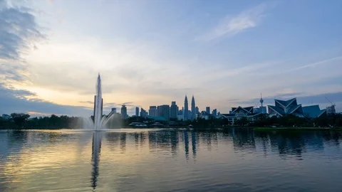 4K Time lapse of moving clouds over Taman Tasik Titiwangsa. Stock Footage 121993459