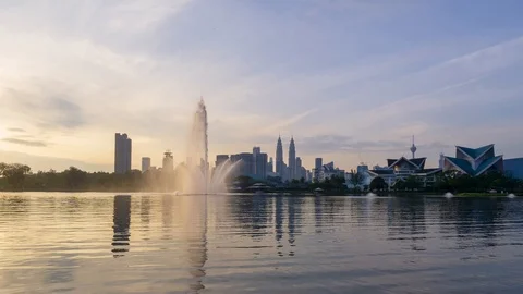 4K Time lapse of moving clouds over Taman Tasik Titiwangsa. Zoom In Stock Footage 121995639