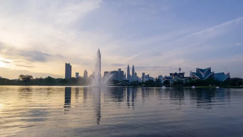 4K Time lapse of moving clouds over Taman Tasik Titiwangsa. Stock Footage 121995641