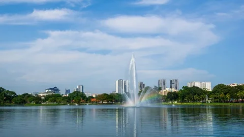 4K Time lapse of moving clouds over Taman Tasik Titiwangsa. Stock Footage 121996772
