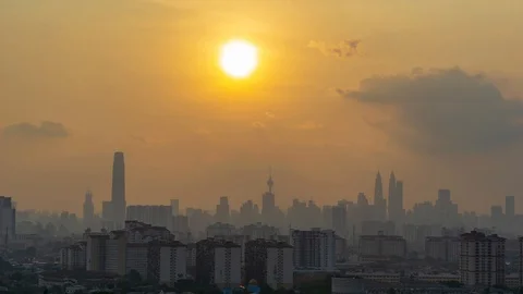 4K Time lapse of moving fluffy monsoon clouds  over downtown Kuala Lumpur Stock Footage 106626590