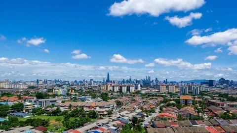 4K Time lapse of moving fluffy monsoon clouds  over downtown Kuala Lumpur. Stock Footage 107461332