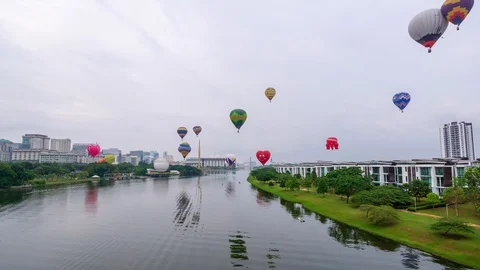 4K Time lapse of moving hot balloons over lake Putrajaya, Malaysia. Stock Footage 105508137