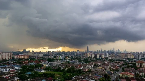 4K Time lapse of moving  stormy monsoon clouds  over downtown Kuala Lumpur Stock Footage 105917067