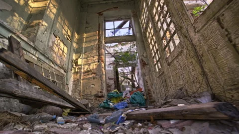 4k time lapse of an old, scary abandoned building with light going through the Stock Footage 335376657
