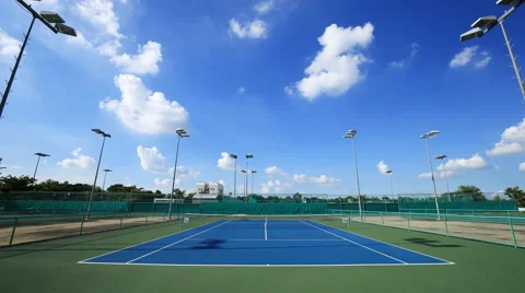 4k Time-lapse of outdoor empty tennis court with blue sky Stock Footage