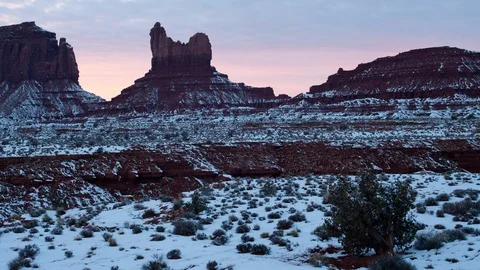 4K Time lapse of pink sunset clouds and snowy rock formations Stock Footage 91669006