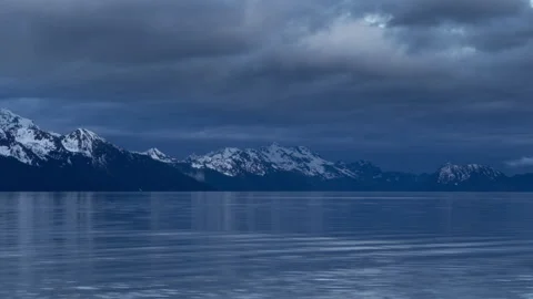 4K time lapse of Resurrection Bay snowy mountains in Seward, Alaska at dusk Stock Footage 243152382