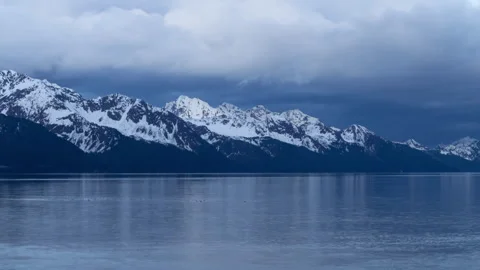 4K time lapse of Resurrection Bay snowy mountains in Seward, Alaska at sunset Stock Footage 243153224